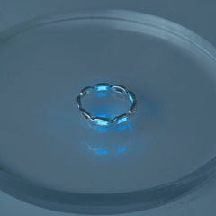 Glow-in-the-dark brass ring